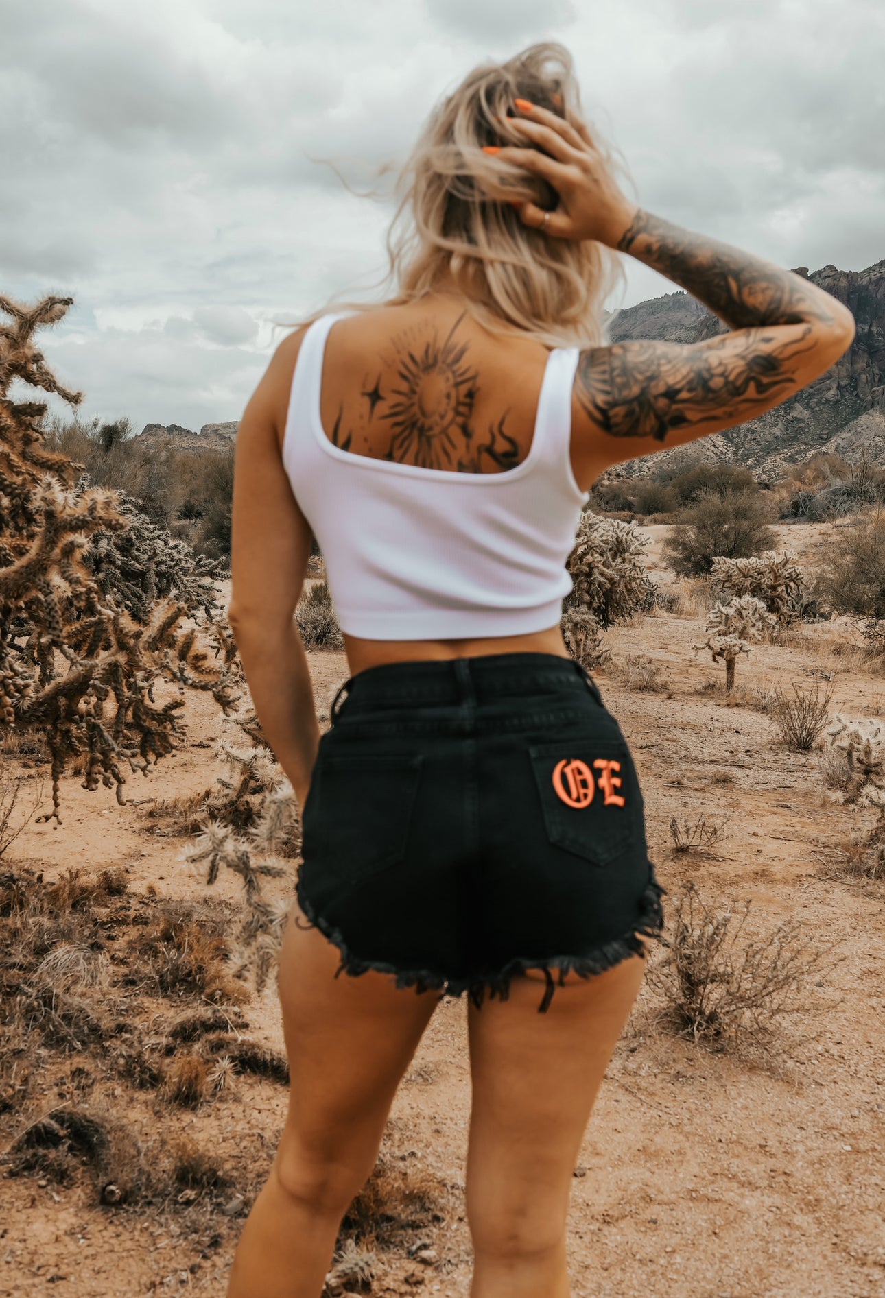 OE branded distressed shorts
