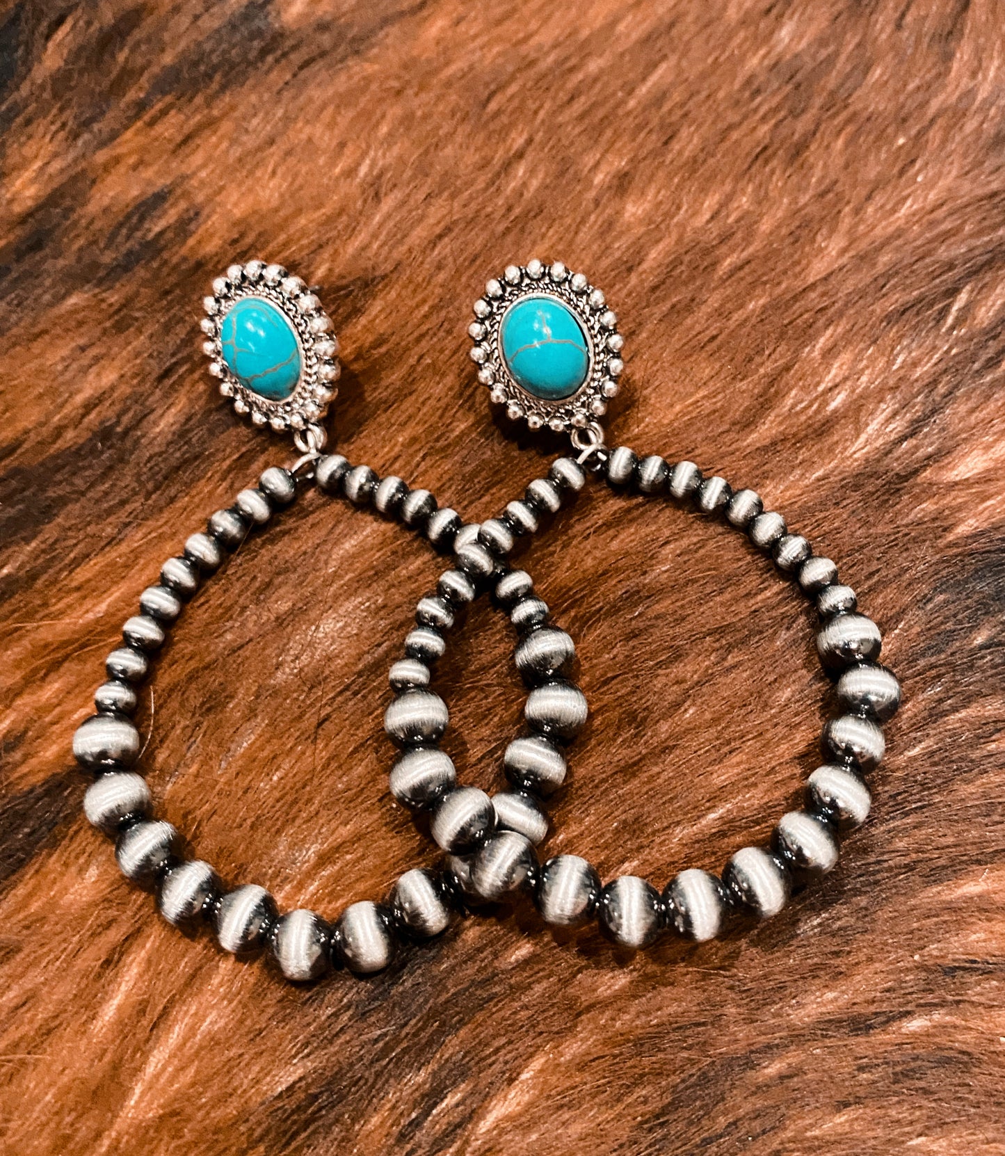Turquoise stone concho and silver Navajo hoop earrings
